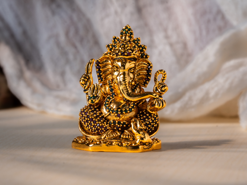 Antique plated Brass Ganesh Idol holding Modak. Small Statue.