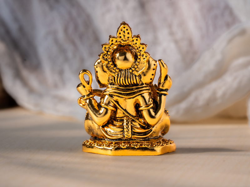 Antique plated Brass Ganesh Idol holding Modak. Small Statue.