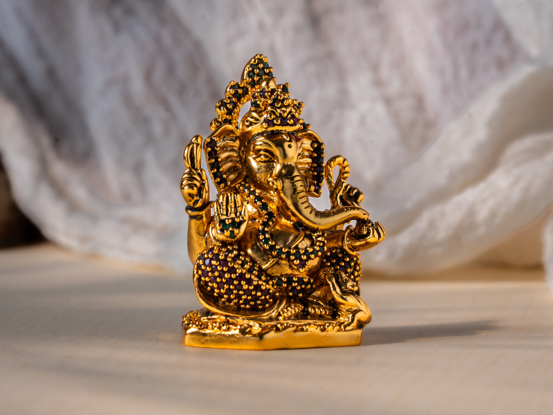 Antique plated Brass Ganesh Idol holding Modak. Small Statue.